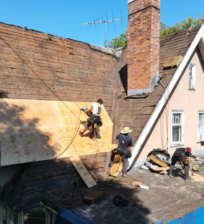 working-on-a-roof Buck Buckley's team working on replacing a roof.